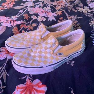 Slightly muted yellow checkered slip on Vans